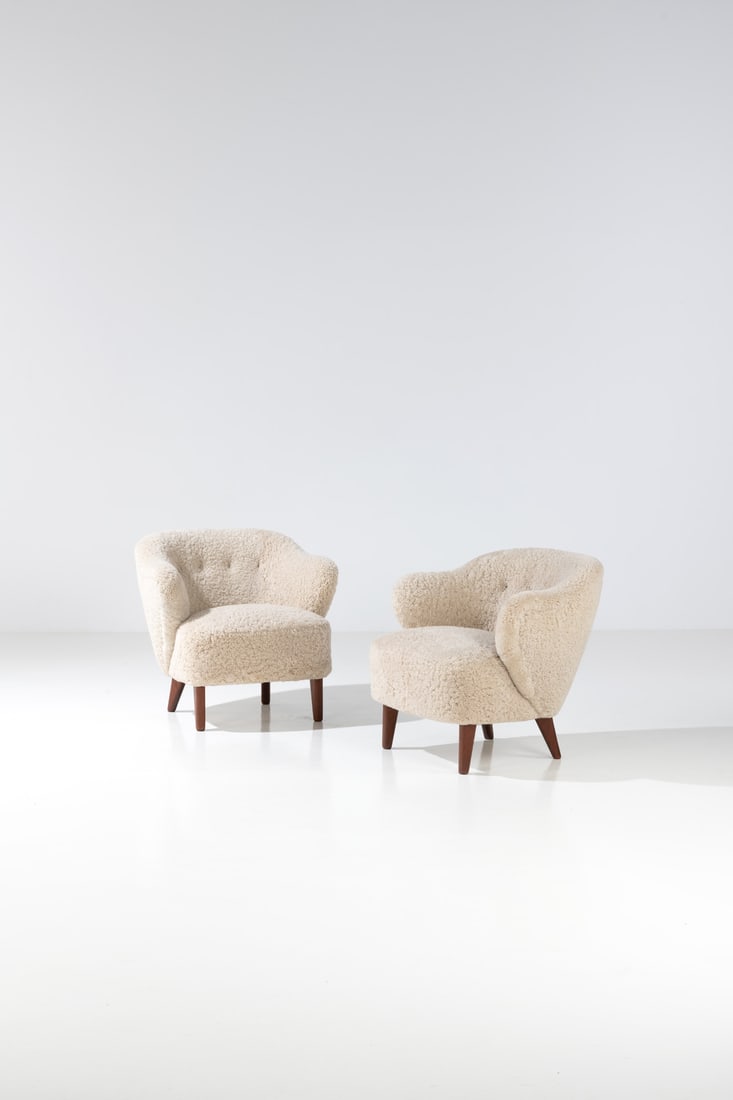 Flemming Lassen (1902-1984) Pair of armchairs: Flemming Lassen (1902-1984)Pair of armchairsTeak and fabricEdited by Jacob KjaerModel created in the 1940sH 76 × L 80 × W 73 cmBibliography : 'Dansk Mobelkunst gennem 40 aar, Volume 2: 1937-