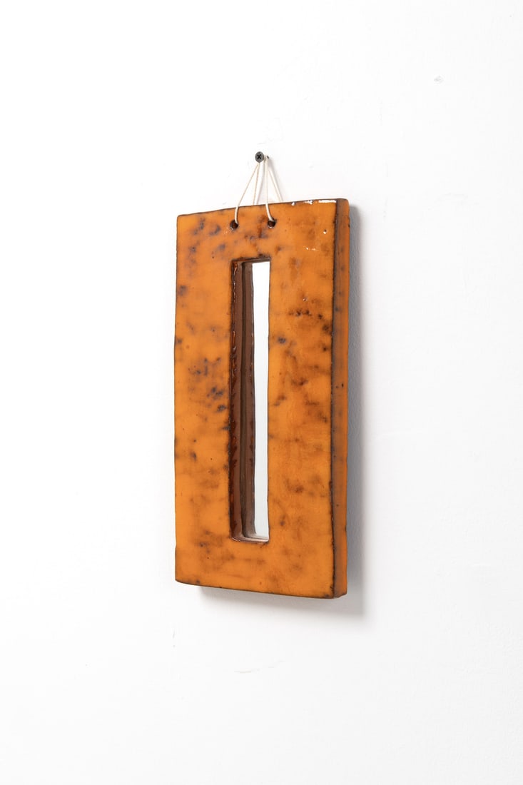 Juliette Derel (1918-2007) Mirror: Juliette Derel (1918-2007)MirrorEnamelled ceramic and mirrored glassModel created circa 1950Incised signature ‘JULIETTE DEREL’ on reverseH 30 x W 15 x 2 cm Provenance: private collection,