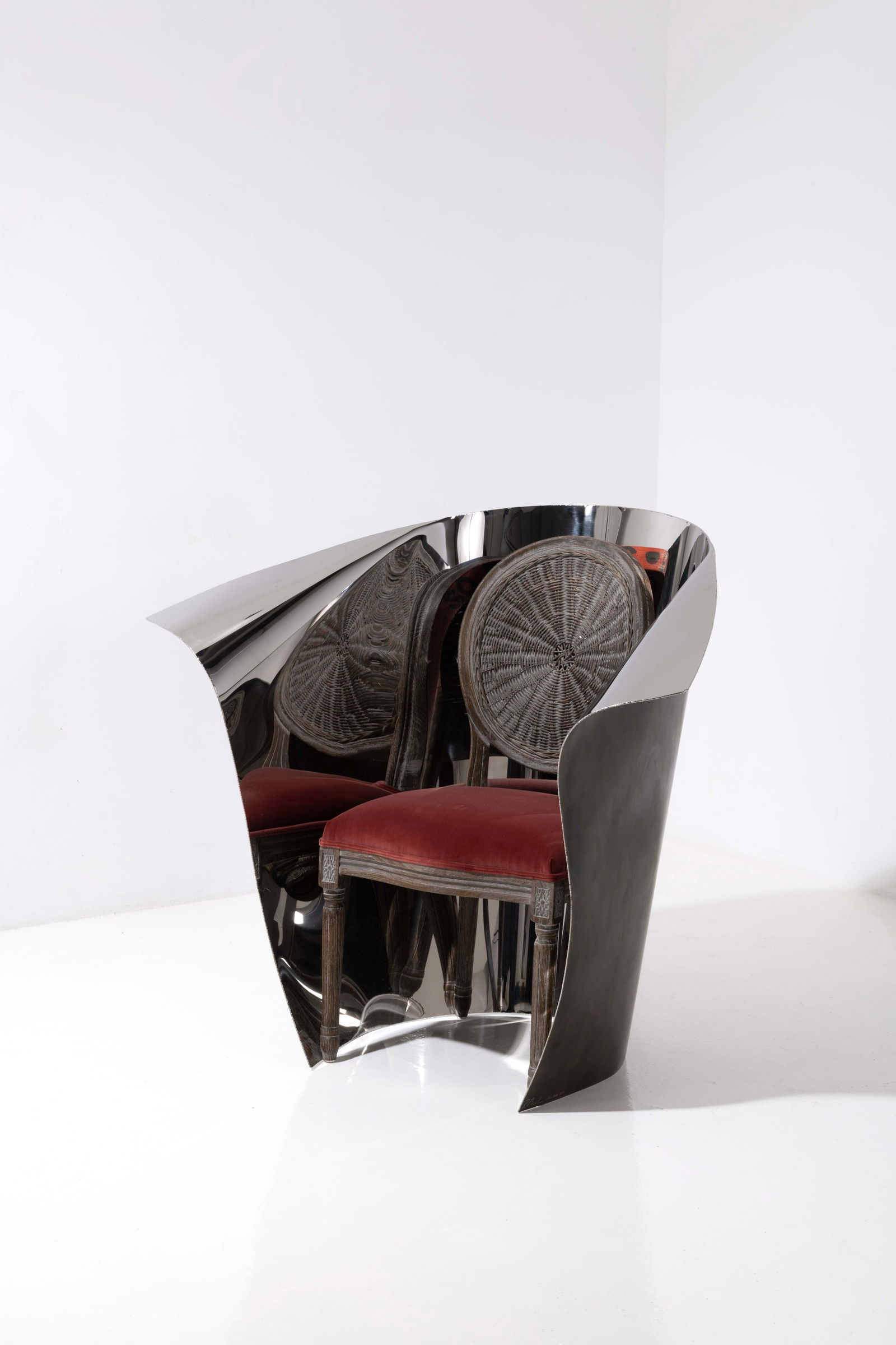 ƒ Ron Arad (born 1951) in collaboration with OKA (founded in 1999) Chair - 'Ako' model: ƒ Ron Arad (born 1951) in collaboration with OKA (founded in 1999)Chair - 'Ako' modelLimited editionOak, rattan, velvet and patinated stainless steel with mirror polishLimited edition of 10, each