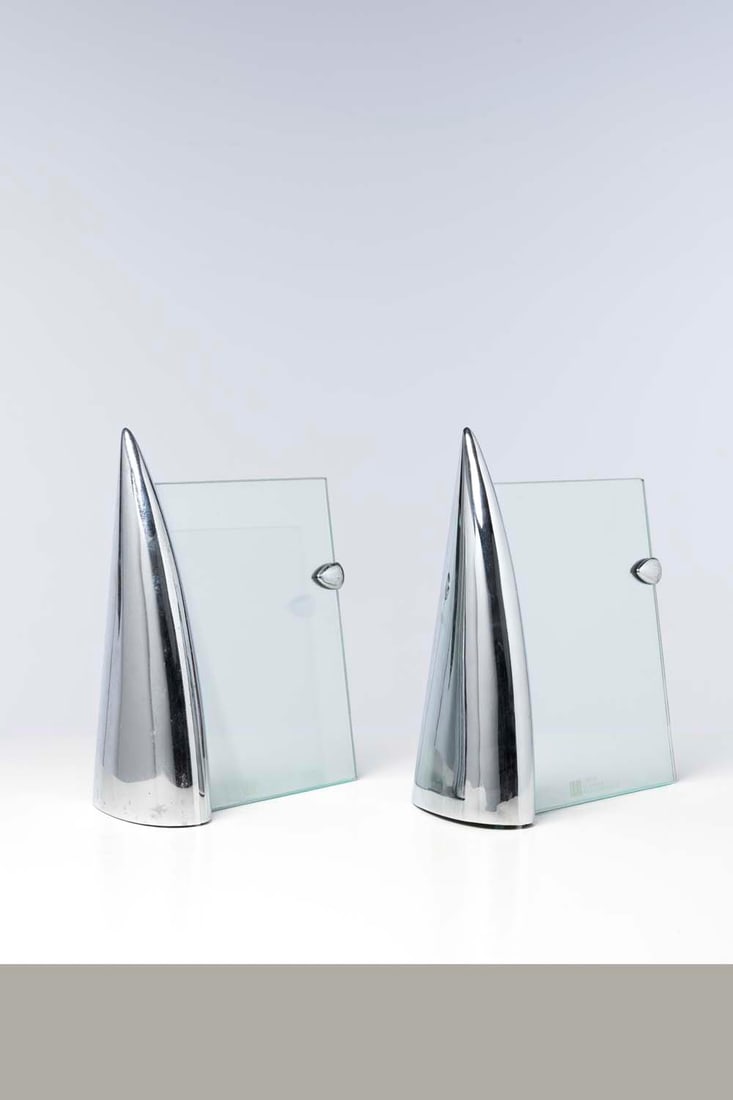 Philippe Starck (born 1949) Two photo frames: Philippe Starck (born 1949)Two photo framesShark n°2 modelGlass and chromed metalModel created in 1987Published by PrésenceSignedH 34.5 x W 29 x D 15 cm