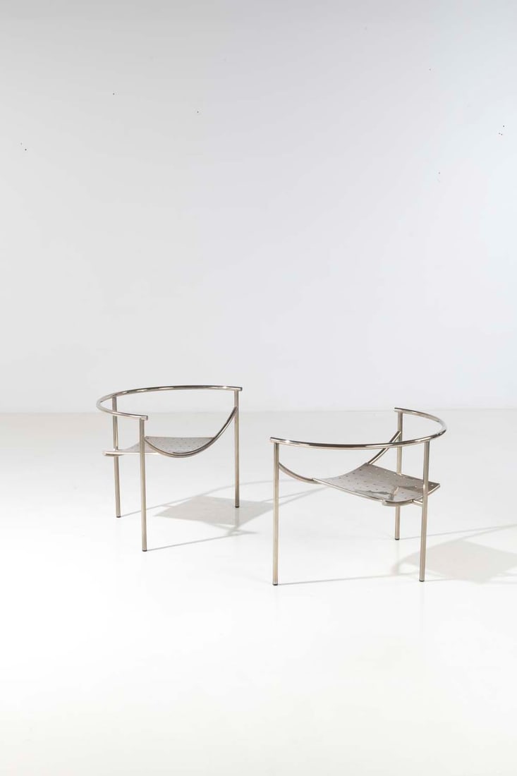 Philippe Starck (born 1949) 'Dr. Sonderbar': Philippe Starck (born 1949)'Dr. Sonderbar'Pair of armchairsChromed tubular steel and perforated sheetingModel created in 1981Publisher XOH 63 x W 90 x D 46 cm
