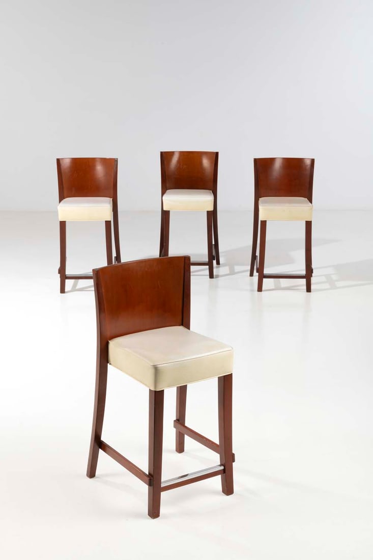 Philippe Starck (born 1949) Neoz: Philippe Starck (born 1949)NeozSuite of four high chairsMahogany teinted wood seat upholstered in original Trevira CS creamModel created in 1995Edited by DriadeH 103 x W 35 x D 48 cm