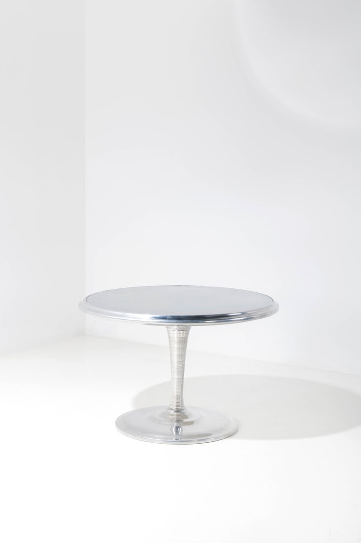 Ron Arad (born 1951) Dining table - 'Spin table' model Mirror polish steel and aluminum Edited by: Ron Arad (born 1951)Dining table - 'Spin table' modelMirror polish steel and aluminumEdited by Ron Arad Associates, limited edition of 6Incised signature 'Ron Arad' on the baseModel created in 1997H 7