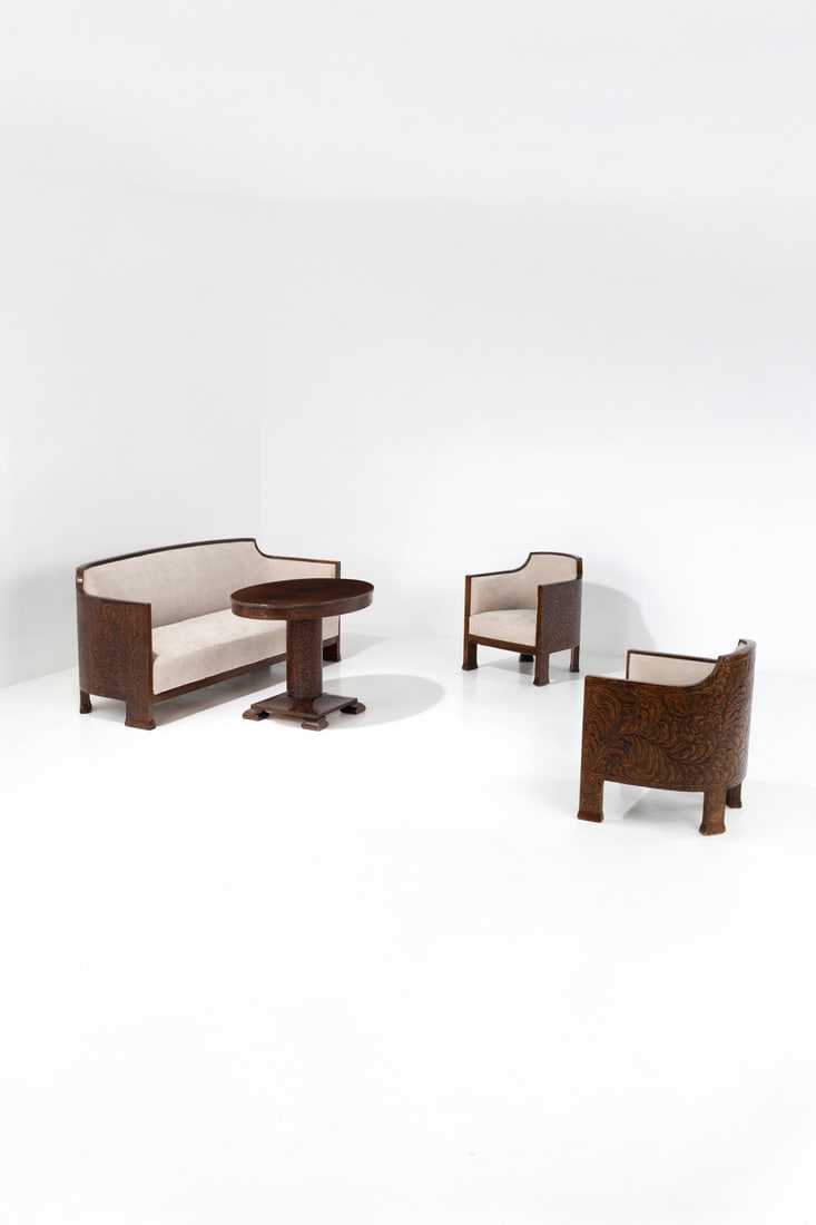 Otto Wretling (1876-1971), attributed to Bench, two armchairs and one table: Otto Wretling (1876-1971), attributed toBench, two armchairs and one tableStained and sculpted pine wood and fabricModel created circa 1910Bench: H 85 × L 198 × W 66 cmArmchairs: H 78,5 