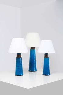 Nils Kähler (1906-1979) Set of three lamps: Nils Kähler (1906-1979)Set of three lampsGlazed ceramic and fabricEdited by Herman A. Kahler KeramikIncised signature beneath eachModels created circa 1960H 39 × Ø 13 cm (with lampshade