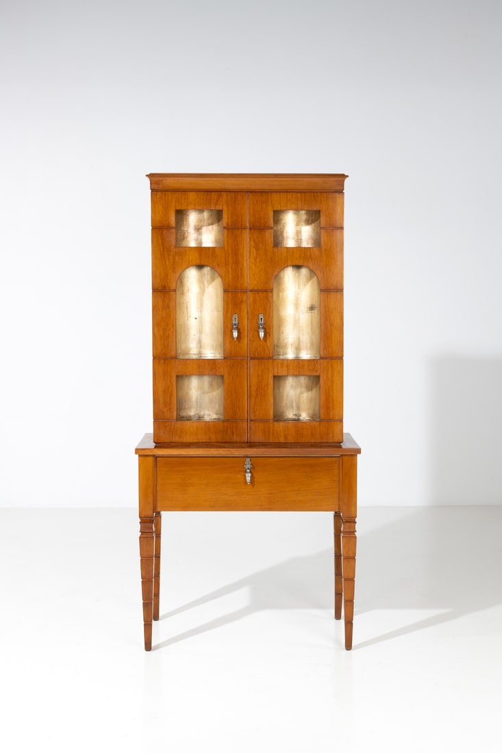 Gio Ponti (1891-1979) & Emilio Lancia (1890-1973): Gio Ponti (1891-1979)& Emilio Lancia (1890-1973)Bar cabinet with lampWalnut, brass, nickel brass, gold leaf, glass and mirrorEdited by Domus NovaModel created circa 1930H 187×L 88×W 47cmExpe