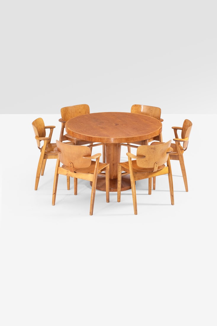 xx Ilmari Tapiovaara (1914-1999) Table and six chairs, 'Domus' model: xx Ilmari Tapiovaara (1914-1999)Table and six chairs, 'Domus' modelLacquered birchModel created circa 1950Table: H 76×Ø116cmChairs: H 78×L 57×W 47cmProvenance: Model created for the Hanko casino,