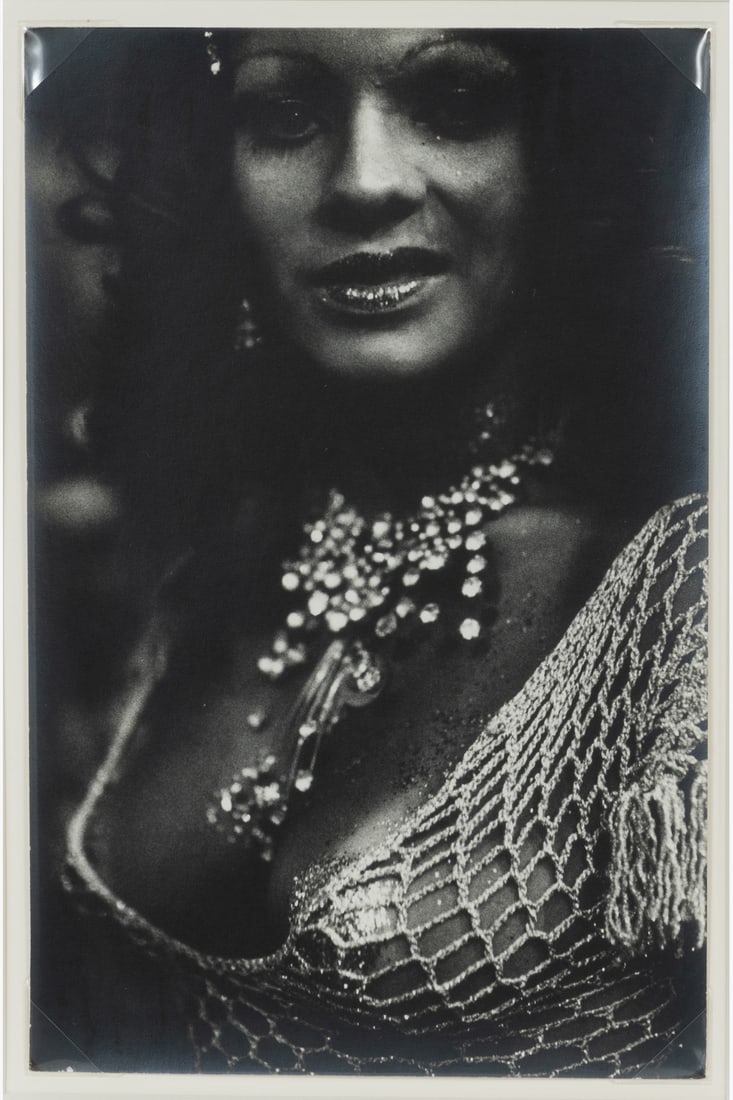 Miguel Rio Branco (1946) Transvestite: Miguel Rio Branco (1946)Transvestite. Brazil, 1978.Vintage silver print, signed and dated in pencil on the reverse.22.7 × 14.7 cm - frame