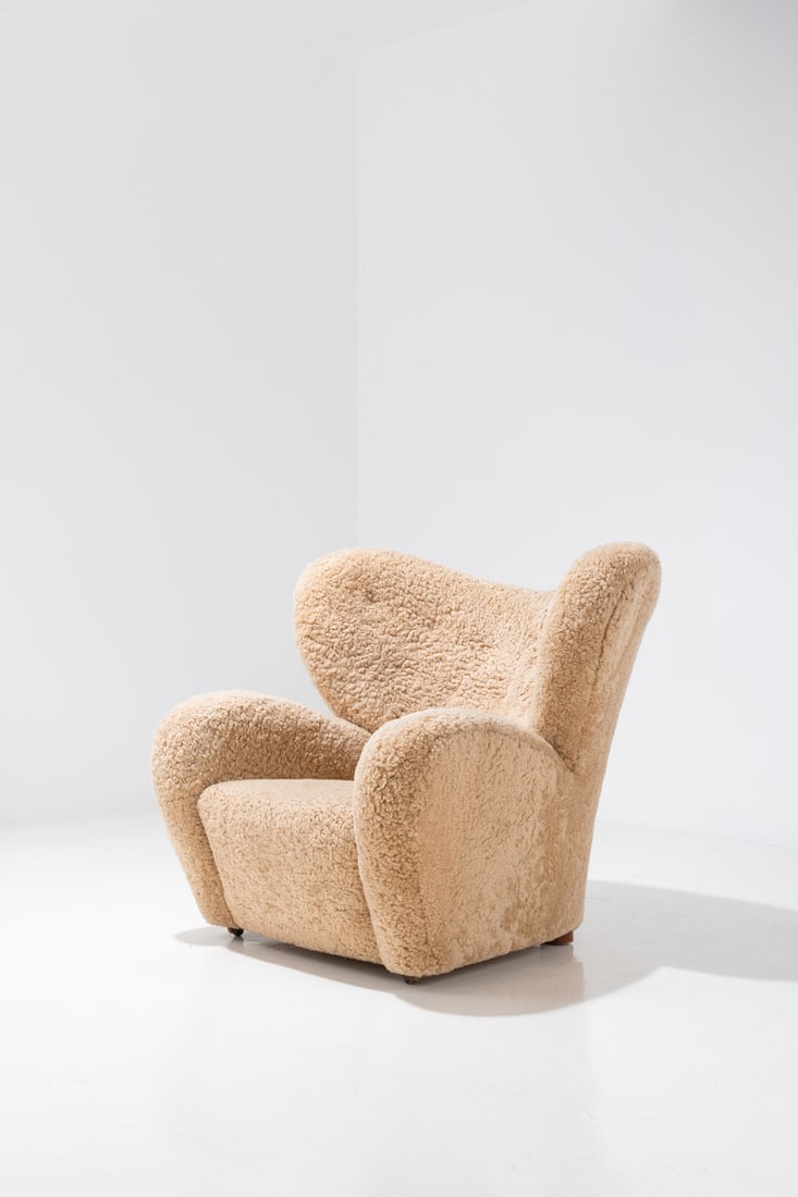 Flemming Lassen (1902-1984) 'Tired man' armchair: Flemming Lassen (1902-1984)'Tired man' armchairOak, wool and fabricEdited by A. J. IversenModel created circa 1935H 89×L 102×W 87cmBibliography:- Møbelhaandværk gennem 25 Aar. A.J.