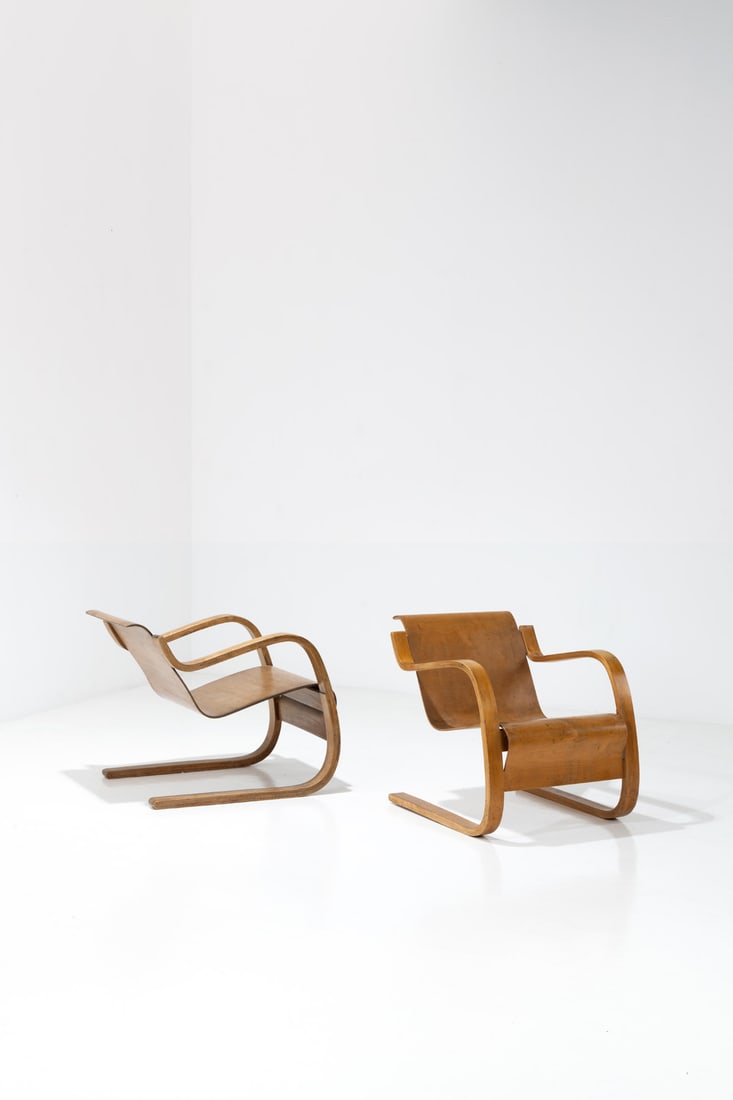 x Alvar Aalto (1898-1976) Pair of armchairs, model no. 31: x Alvar Aalto (1898-1976)Pair of armchairs, model no. 31BirchEdited by Huonekalu-ja Rakennustyötehdas OyModel created in 1935H 65×L 60,5×W 77cmBibliography:- 'Alvar & Aino Aalto: design
