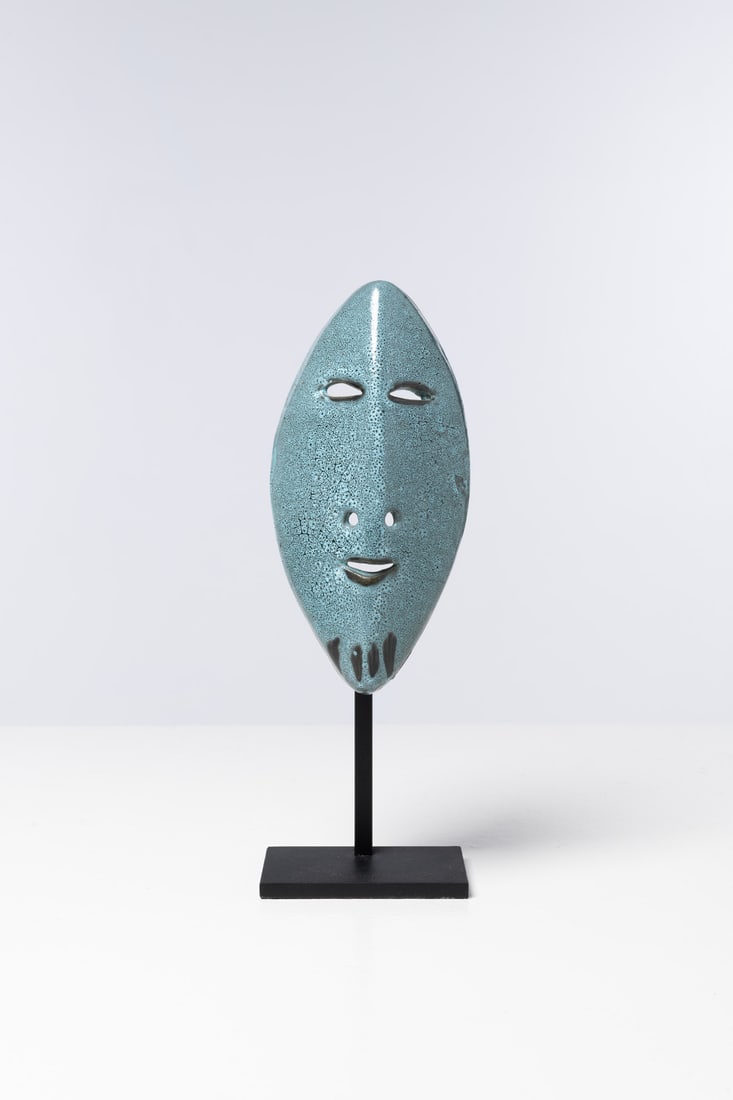 Accolay (20th century) Masquerade: Accolay (20th century)MasqueradeGlazed ceramic and lacquered metalIncised signature 'Azoulay YF' and artist's monogramModel created circa 1960Mask: H 22 × W 11 × D 5.5 cmWith base: H 33 