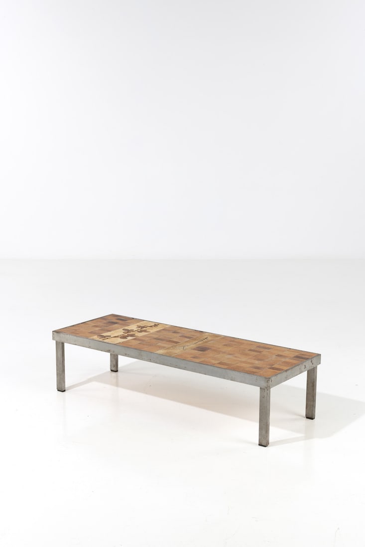 Roger Capron (1922-2006) Coffee table - 'Herbarium' model Glazed ceramic and steel Signed on a: Roger Capron (1922-2006)Coffee table - 'Herbarium' modelGlazed ceramic and steelSigned on a border tile 'Capron'Model created circa 1960H 30 × W 119.5 × D 44 cm