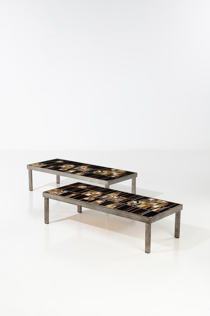 Roger Capron (1922-2006) Pair of coffee tables - 'Le Village' model Glazed ceramic and steel Signed: Roger Capron (1922-2006)Pair of coffee tables - 'Le Village' modelGlazed ceramic and steelSigned on a border tile 'R.Capron'Model created circa 1960H 30 × W 117 × D 49 cm