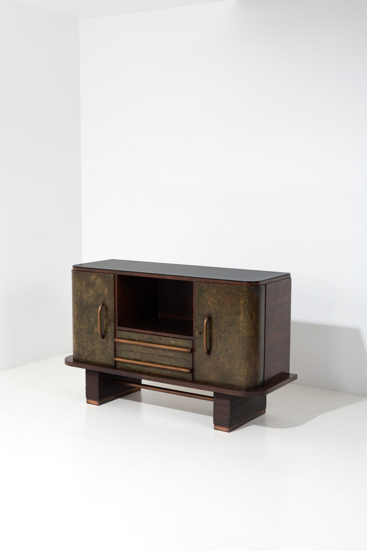 Osvaldo Borsani (1911-1985) Sideboard: Osvaldo Borsani (1911-1985)SideboardWalnut, stained parchment, brass, stained glass, copper and brassEdited by Arredamenti Borsani VaredoModel created in the first half of the 1930sH 92×L 151 