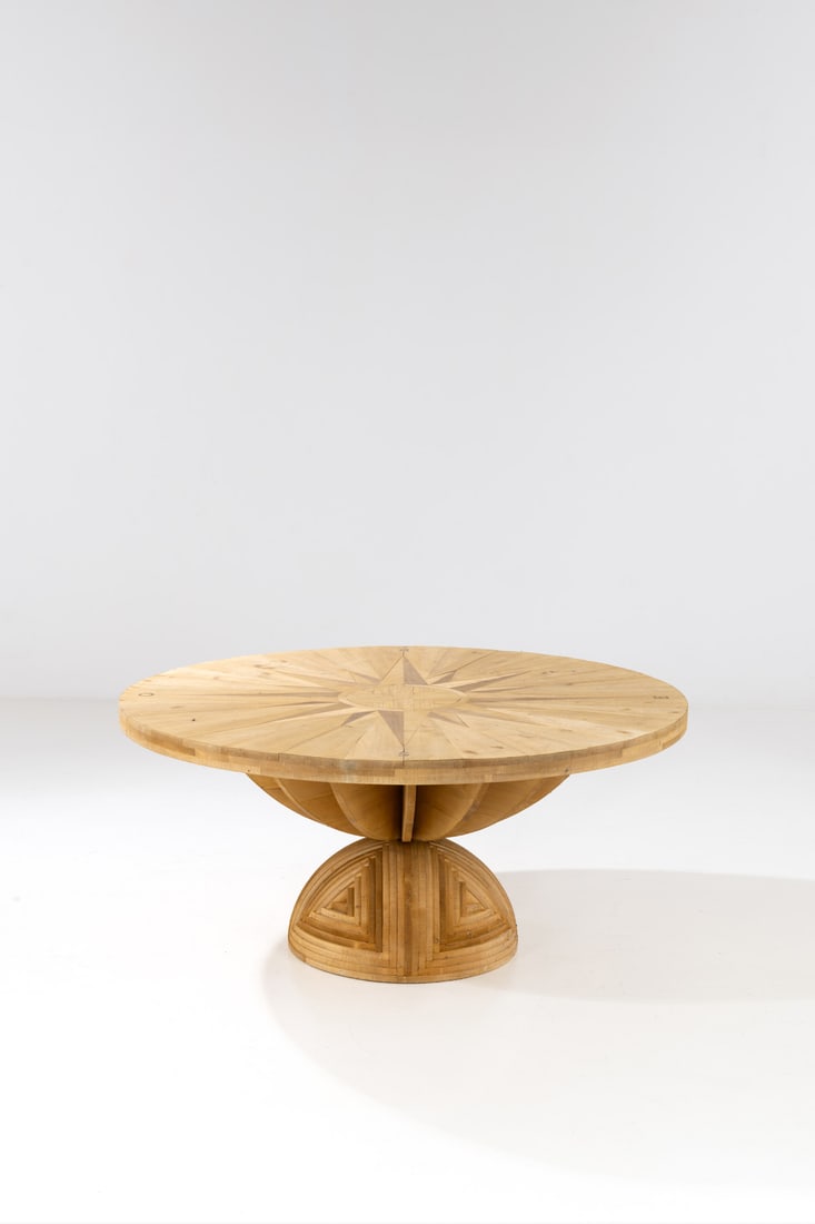 Mario Ceroli (born 1938) Table - 'Rosa dei Venti': Mario Ceroli (born 1938)Table - 'Rosa dei Venti' ModelPine wood and brassEdited by PoltronovaModel created in 1973H 76×Ø165cmBibliography: G. Gramigna, "Repertorio delDesign Italiano 1950-20