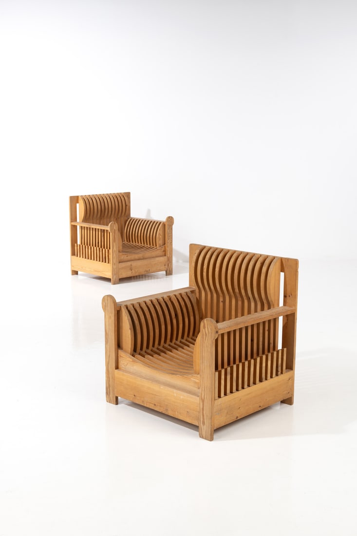 Mario Ceroli (born 1938) Pair of 'Acqua e Terra' armchairs 'Mobili nella Valle' series: Mario Ceroli (born 1938)Pair of 'Acqua e Terra' armchairs'Mobili nella Valle' seriesPine woodEdited by PoltronovaInscribed with 'Ceroli /Poltronova'Model created circa 1970H 81 ×L 83×W 67cm