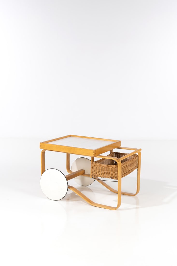 Alvar Aalto (1898-1976) Drinks trolley - Model no 901: Alvar Aalto (1898-1976)Drinks trolley - Model no. 901Birch and rattanEdited by Huonekalu-ja RakunnustyötehdasKorhonen for ArtekModel created circa 1950H 56×L 92×W 50cmBibliography:- B.