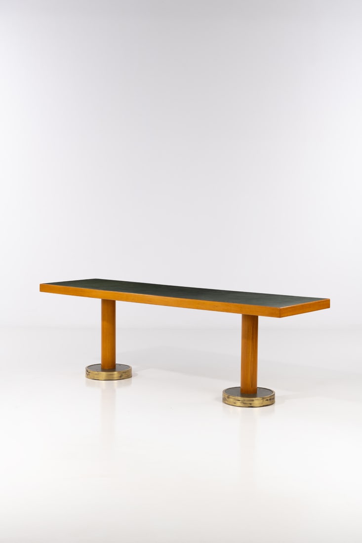 Gio Ponti (1891-1979) 'Conte Grande' dining table: Gio Ponti (1891-1979)'Conte Grande' dining tableBeech, oak, brass and stained melamineModel created circa 1947H 80×L 245×W 68cmProvenance: Model created for of transatlantic liner Conte Gran