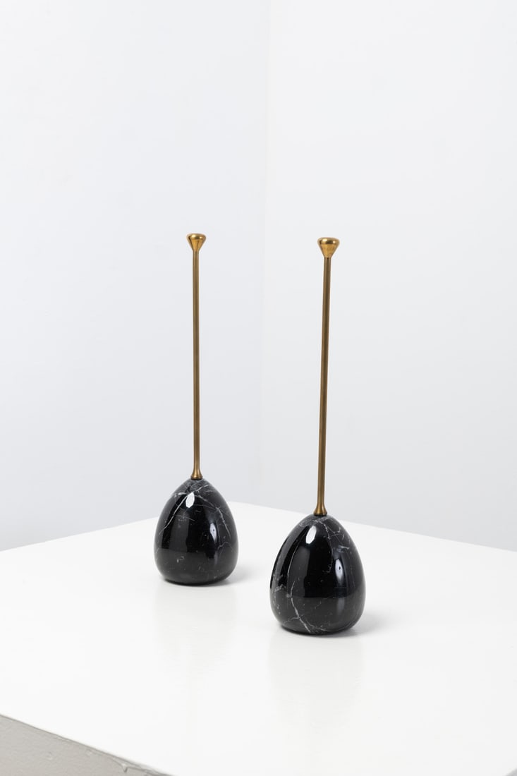 Luigi Caccia Dominioni (1913-2016) Pair of doorstops: Luigi Caccia Dominioni (1913-2016)Pair of doorstopsBrass and marbleEdited by AzucenaModel created in the 1950sH 43,5×Ø11 cmBibliography: Domus no. 231, December 1948,variation illustrated p.