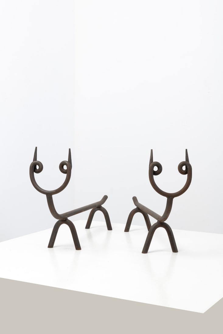 Gio Ponti (1891-1979) Pair of andirons: Gio Ponti (1891-1979)Pair of andironsLacquered cast ironModel created circa 1940H 35×L 60×W 14cmExpertise conducted by the Gio Ponti Archives.