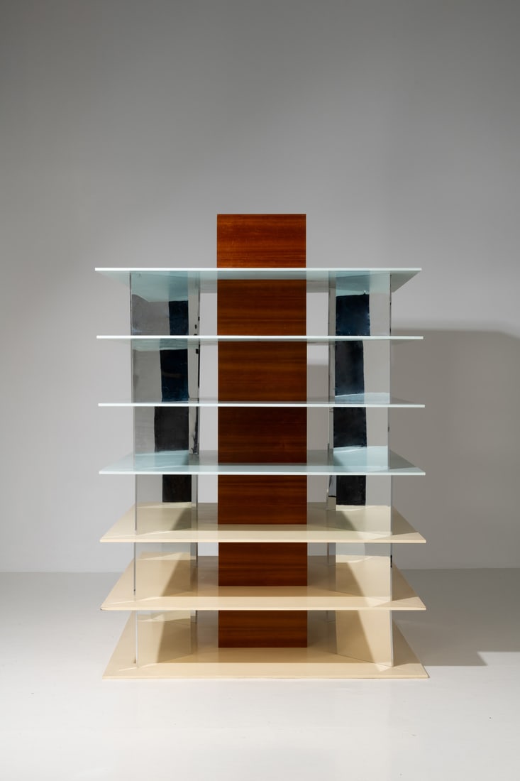 Sottsass Associati (active 1980-2007) Bookcase - "Tour" model Unique piece Corian, mirror, stainless: Sottsass Associati (active 1980-2007)Bookcase - "Tour" modelUnique pieceCorian, mirror, stainless steel and cherrywood veneerModel created in the 2000sH 220 × L 150 × W 150cmExhibition: Muse