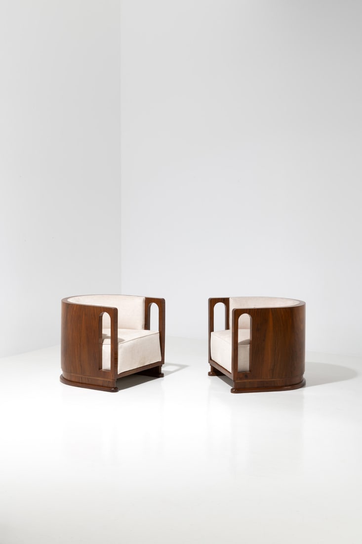 Gio Ponti (1891-1979) Pair of 'Colosseo' armchairs: Gio Ponti (1891-1979)Pair of 'Colosseo' armchairsWalnut and fabricArtist’s signature on a plaqueModel created in the 1930sH 59 × L 65,5 × W 66 cmExpertise conducted by the Gio Ponti