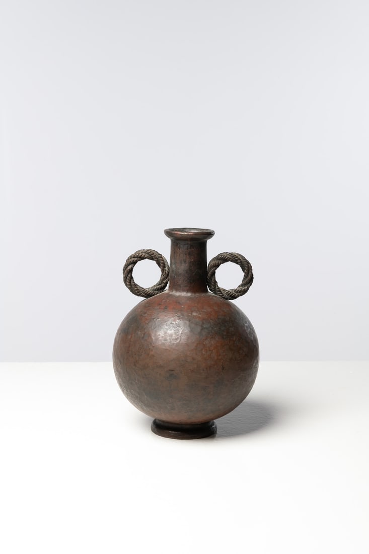 Gio Ponti (1891-1979) & Nino Ferrari (Edited by, 20th c.): Gio Ponti (1891-1979)& Nino Ferrari (Edited by, 20th c.)VaseHammered brassEdited by Nino FerrariIncised 'Nino Ferrari' signature beneath the baseModel created circa 1933H 30 × Ø 20