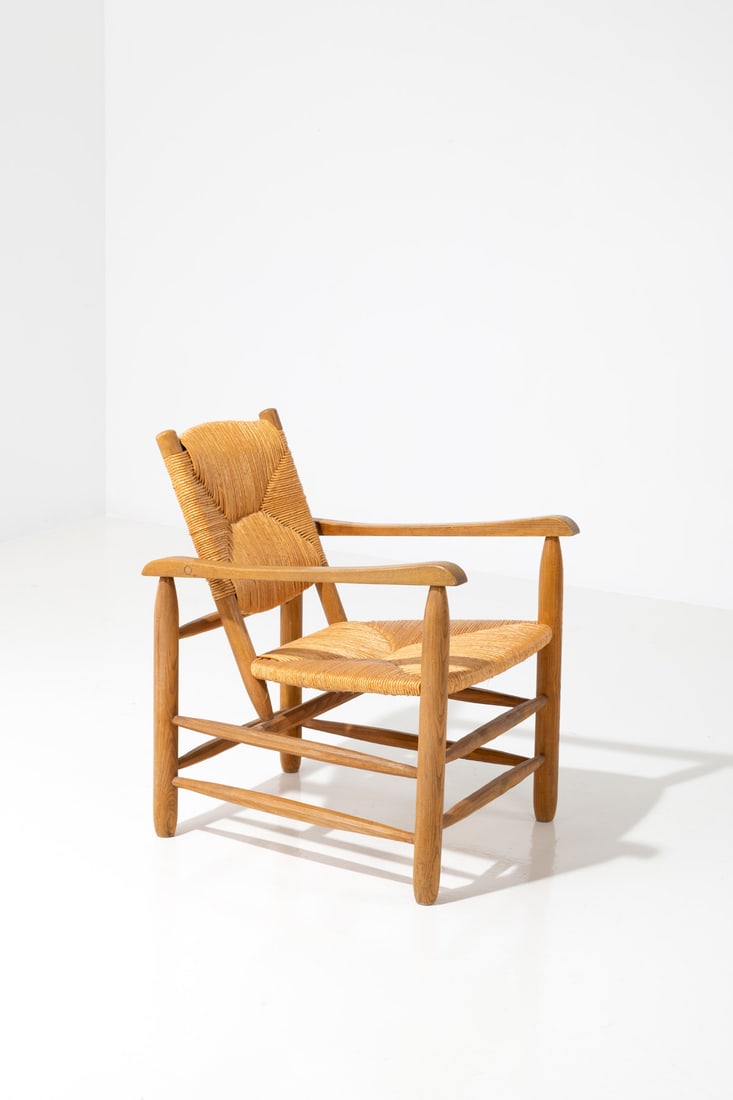 Charlotte Perriand (1903-1999) Armchair n°21, 'Chamrousse': Charlotte Perriand (1903-1999)Armchair n°21, 'Chamrousse'Ash wood and strawEdited by L'Équipement de la MaisonModel created in 1935H 76 × L 44 × W 63 cmNote: In 1935, Charlotte