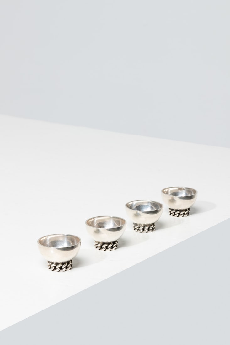 Jean Després (1889-1980) Set of four salt cellars: Jean Després (1889-1980)Set of four salt cellarsSilver-plated metalTwo signed 'J-Després'Model created circa 1950H 2,5 × L 4 × W 4 cm