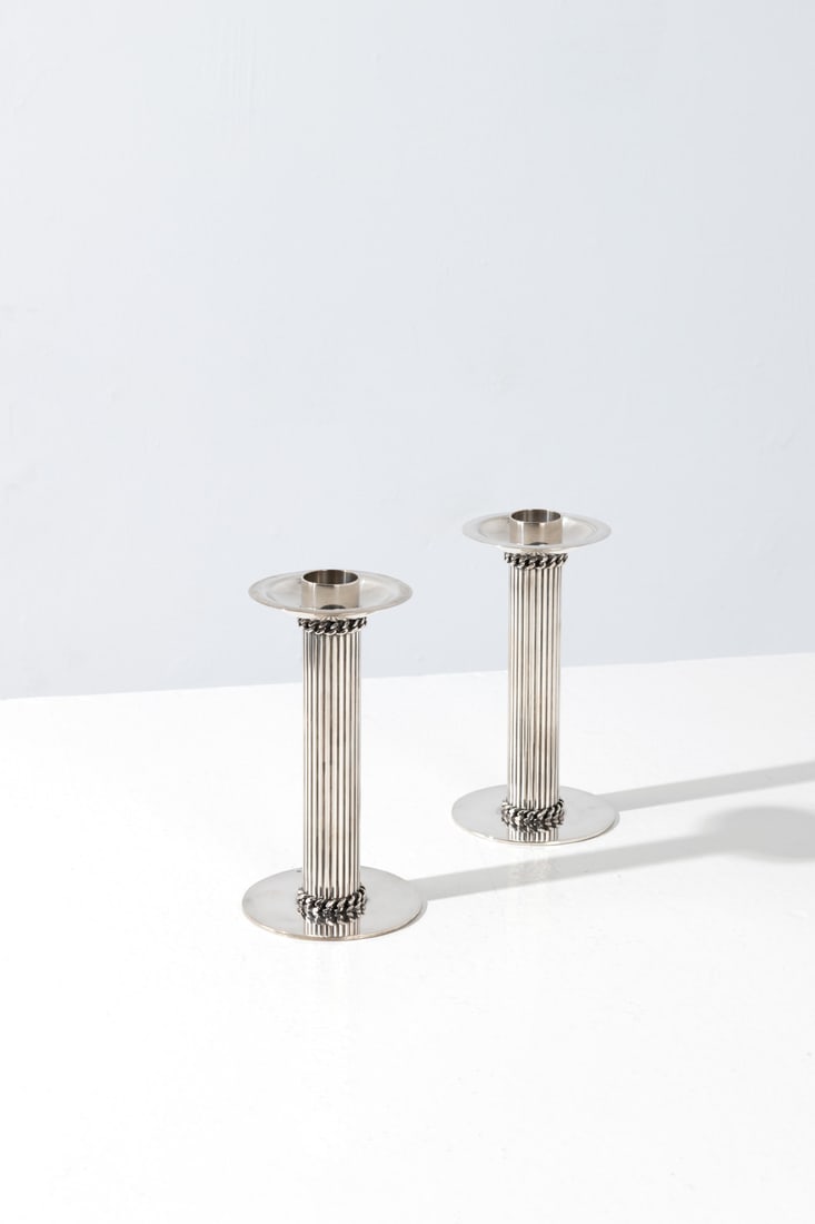 Jean Després (1889-1980) Pair of candle holders: Jean Després (1889-1980)Pair of candle holdersSilver-plated metalIncised signature, 'J. Després' on the underside and silversmith’s hallmarksModel created circa 1950H 15 × Ø