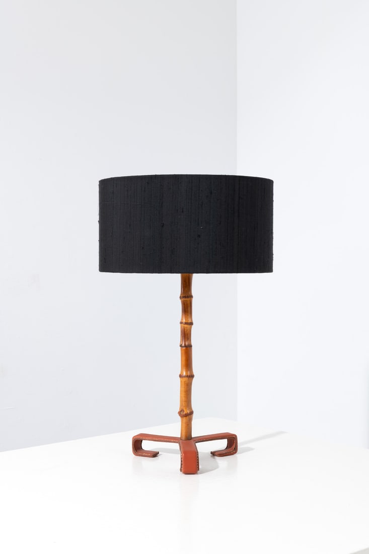 Jacques Adnet (1918-1992) Table lamp: Jacques Adnet (1918-1992)Table lampLeather, bamboo and fabricModel created circa 1950H 38 × Ø 22 cmWith lampshade: H 56 × Ø 35 cm