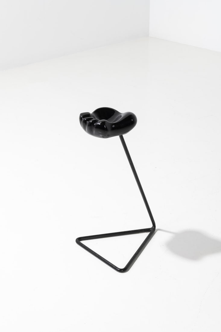 Georges Jouve (1910-1964) & Mathieu Matégot (1910-2001) 'Patte d'ours' ashtray on pedestal foot: Georges Jouve (1910-1964) & Mathieu Matégot (1910-2001)'Patte d'ours' ashtray on pedestal footGlazed ceramic and lacquered metalModel created circa 1951Pied: H 55 × L 29 × W 35 cmAshtra