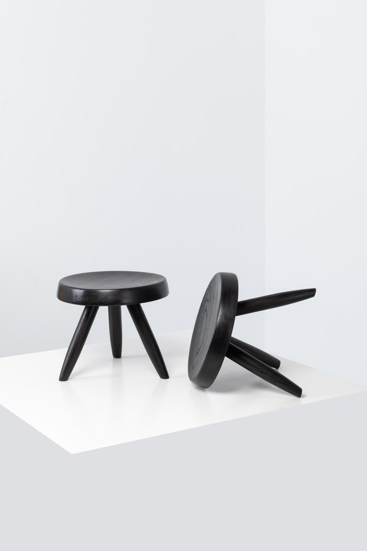 Charlotte Perriand (1903-1999) Pair of low 'Berger' stools: Charlotte Perriand (1903-1999)Pair of low 'Berger' stoolsStained ash woodModel created circa 1955H 28 × Ø 33 cmBibliography:- 'Charlotte Perriand, L'Œuvre complète, Volume 2: 1940-