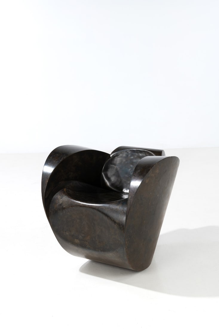 x Ron Arad (born 1951) Rocking chair - Model 'Rolling Volume': x Ron Arad (born 1951)Rocking chair - Model 'Rolling Volume'no. 17/20Patinated steelEdited by Ron Arad Associates, limited edition of 20 + 5 artist’s proofs'Ron Arad 17/20' engraved on the base