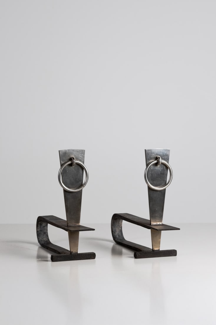 Modernist work (XXth century) Pair of andirons Wrought iron and steel Model created circa 1970 H 37: Modernist work (XXth century)Pair of andironsWrought iron and steelModel created circa 1970H 37.5 × W 16 × D 48.5 cm