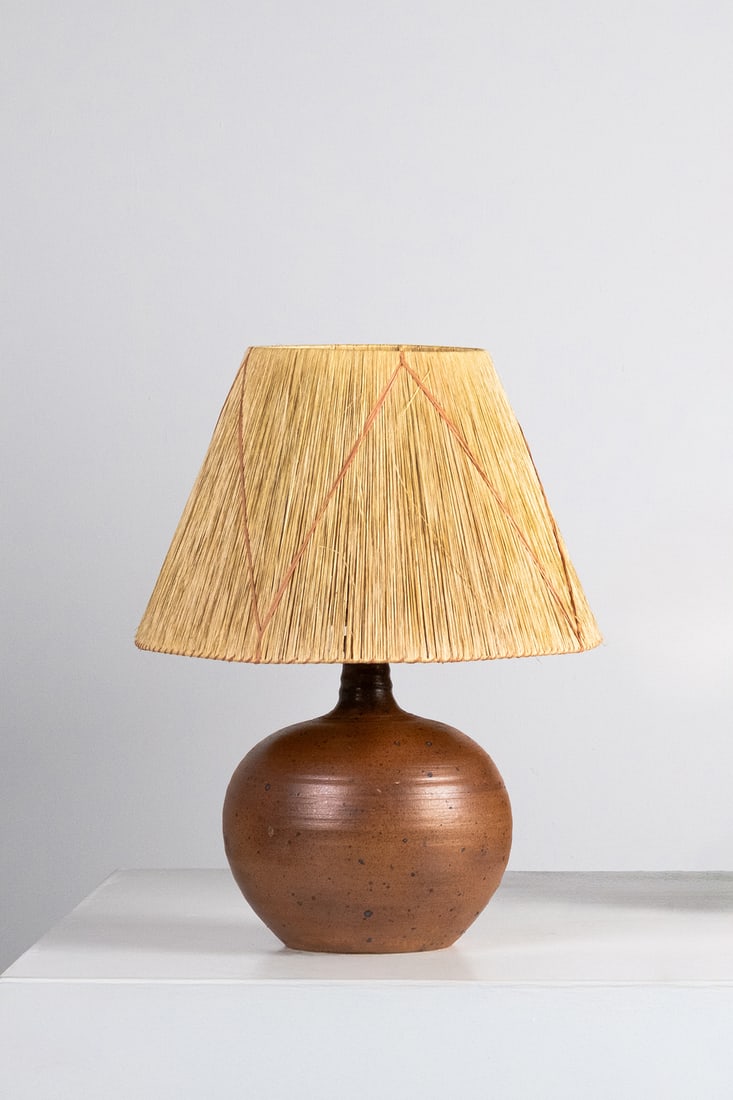 Pierre Digan (1941–2016) Table lamp Stoneware and raffia Incised studio stamp on the base: Pierre Digan (1941–2016)Table lampStoneware and raffiaIncised studio stamp on the baseModel created circa 1970H 45.5 × Ø 35 cm
