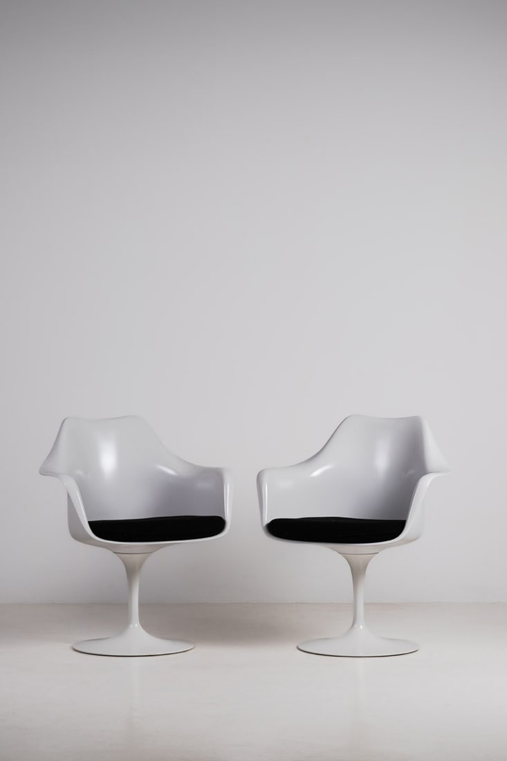 Eero Saarinen (1910–1961) Pair of swivel armchairs - 'Tulip' Model Fibreglass, aluminium and: Eero Saarinen (1910–1961)Pair of swivel armchairs - 'Tulip' ModelFibreglass, aluminium and leatherManufactured by KnollManufacturer's plaque under the basesModel created in 1956H 82 × W 67.