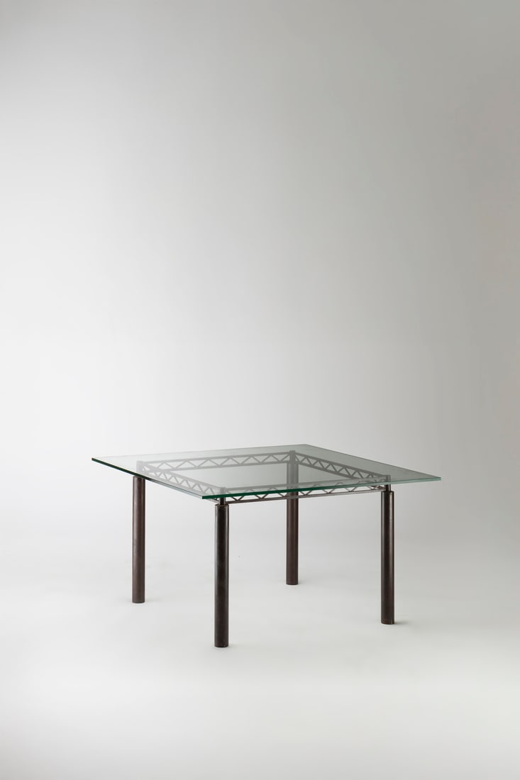 Jean-Michel Wilmotte (born in 1948) Dining table - 'Iron Bridge' Model Waxed rusted steel and glass: Jean-Michel Wilmotte (born in 1948)Dining table - 'Iron Bridge' ModelWaxed rusted steel and glassManufactured by AcademyModel created in 1982H 72.5 × W 120 × D 120 cm