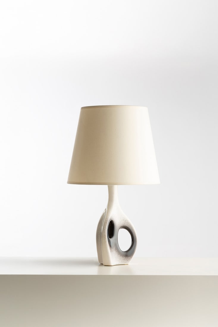 Denyse Gatard (1921–1992) Table lamp Glazed ceramic and fabric Incised monogram 'DG' on the: Denyse Gatard (1921–1992)Table lampGlazed ceramic and fabricIncised monogram 'DG' on the reverseModel created circa 1950Without shade: H 20 × Ø 35 cmWith shade: H 25 × W 12 ×