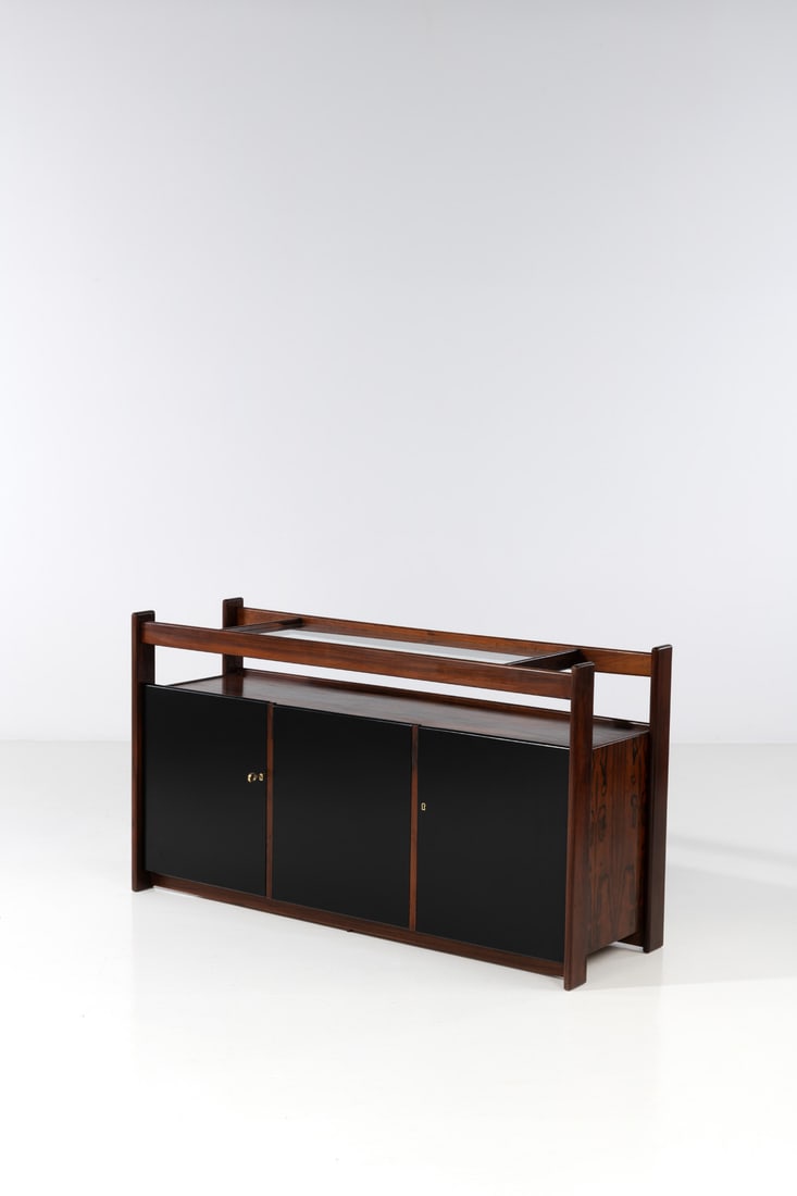 Sergio Rodrigues (1927-2014) Sideboard: Sergio Rodrigues (1927-2014)SideboardImbuia veneer, lacquered wood, brass and glassEdited by OCAModel created in the 1960sH 93 × L 171 × W 55 cm