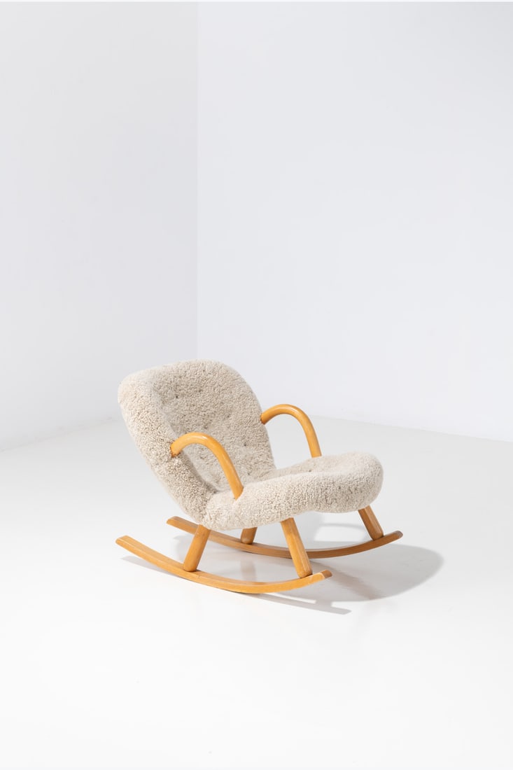 Philip Arctander (1916-1994), attributed to 'Clam' rocking armchair: Philip Arctander (1916-1994), attributed to 'Clam' rocking armchair Birch and fabric Edited by Vik & Blindheim Model created circa 1945 H 71 × L 64 × W 93 cm
