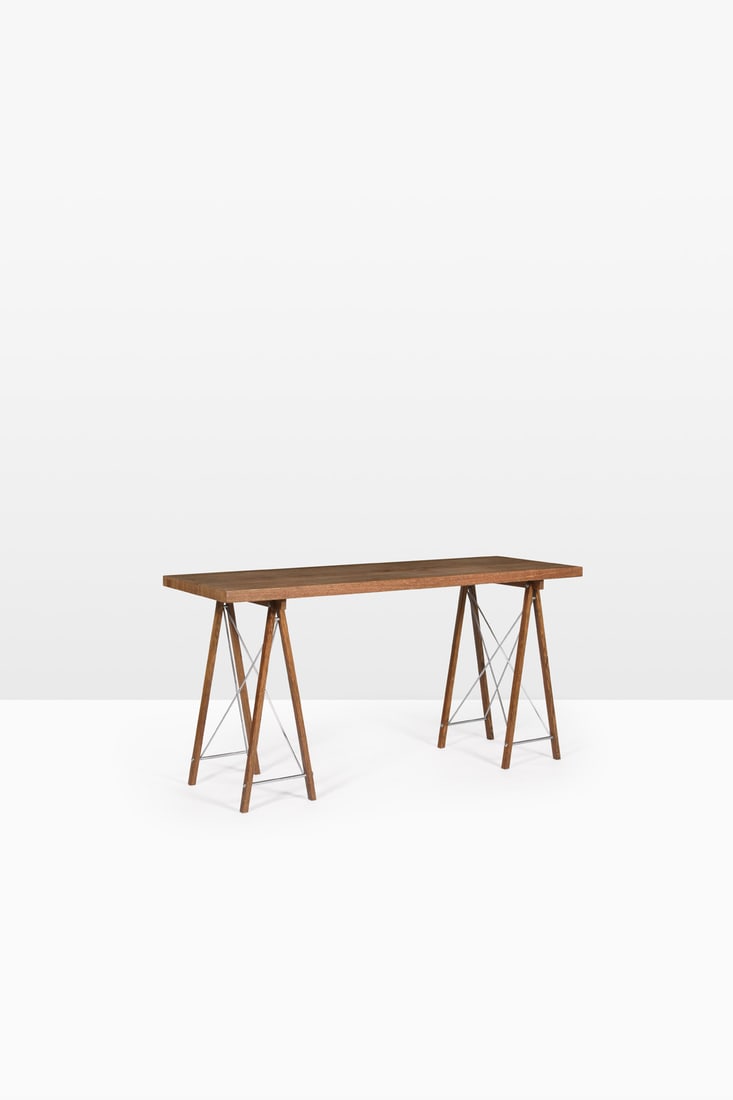 Jules Wabbes (1919-1974) Trestle console: Jules Wabbes (1919-1974) Trestle console Laminated solid wenge and nickel-plated metal Model created circa 1958 H 76 × L 150,5 × W 55 cm Bibliography: - M. Ferran-Wabbes, 'Jules Wabbes,