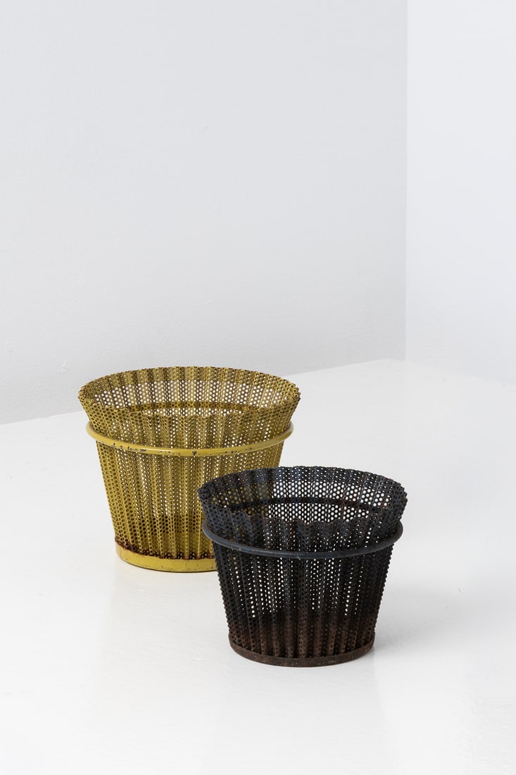 Mathieu Matégot (1910-2001) Set of two planters: Mathieu Matégot (1910-2001) Set of two planters Lacquered and perforated sheet metal (rigitulle) Model created circa 1955 H 12 × Ø 15,5 cm H 10 × Ø 13 cm Bibliography: P.