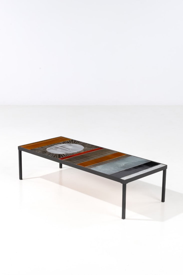 Roger Capron (1922-2006) ‘Soleil’ coffee table: Roger Capron (1922-2006) ‘Soleil’ coffee table Enameled lava and patinated iron Signed ‘R. Capron’ Model created circa 1965 H 30 × L 121 × W 51 cm Bibliography: P. St