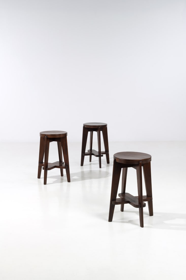 Pierre Jeanneret (1896-1967) Set of three high stools: Pierre Jeanneret (1896-1967) Set of three high stools Teak Model created circa 1965-1966 H 68 × Ø 52 cm Provenance: Administrative buildings, Chandigarh, India Bibliography: E. Touchaleaume