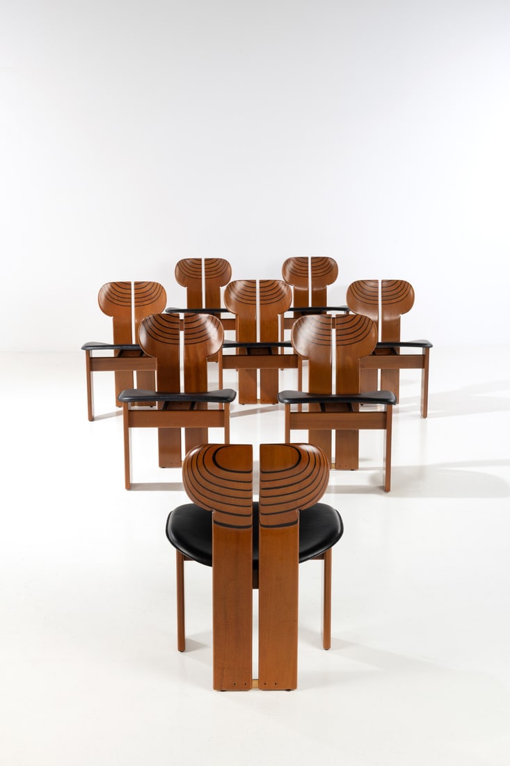 Afra (1937-2011) & Tobia Scarpa (Born 1935) Set of eight chairs - 'Africa' Model: Afra (1937-2011) & Tobia Scarpa (Born 1935) Set of eight chairs - 'Africa' Model Artona series Walnut, ebony, leather and brass Edited by Maxalto Manufacturer’s stamp on the back of the seating