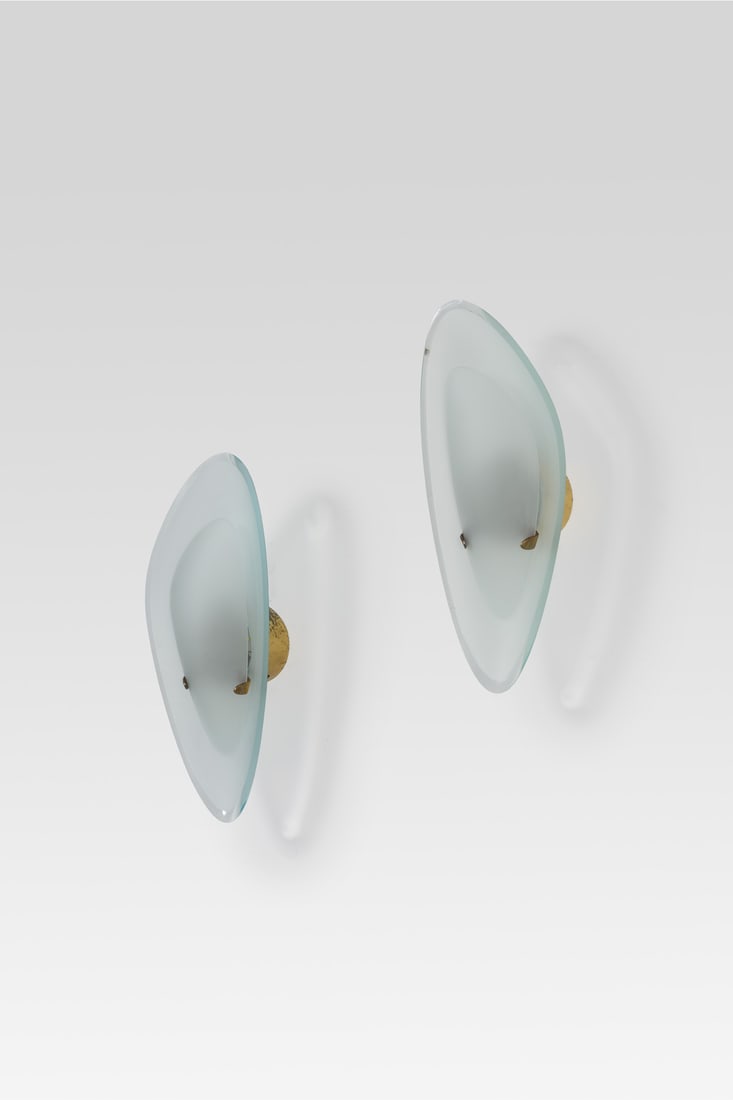 Max Ingrand (1908-1969): Max Ingrand (1908-1969) Pair of sconces Glass and brass Edited by Fontana Arte Model created circa 1960 H 43 × L 18 × W 12 cm