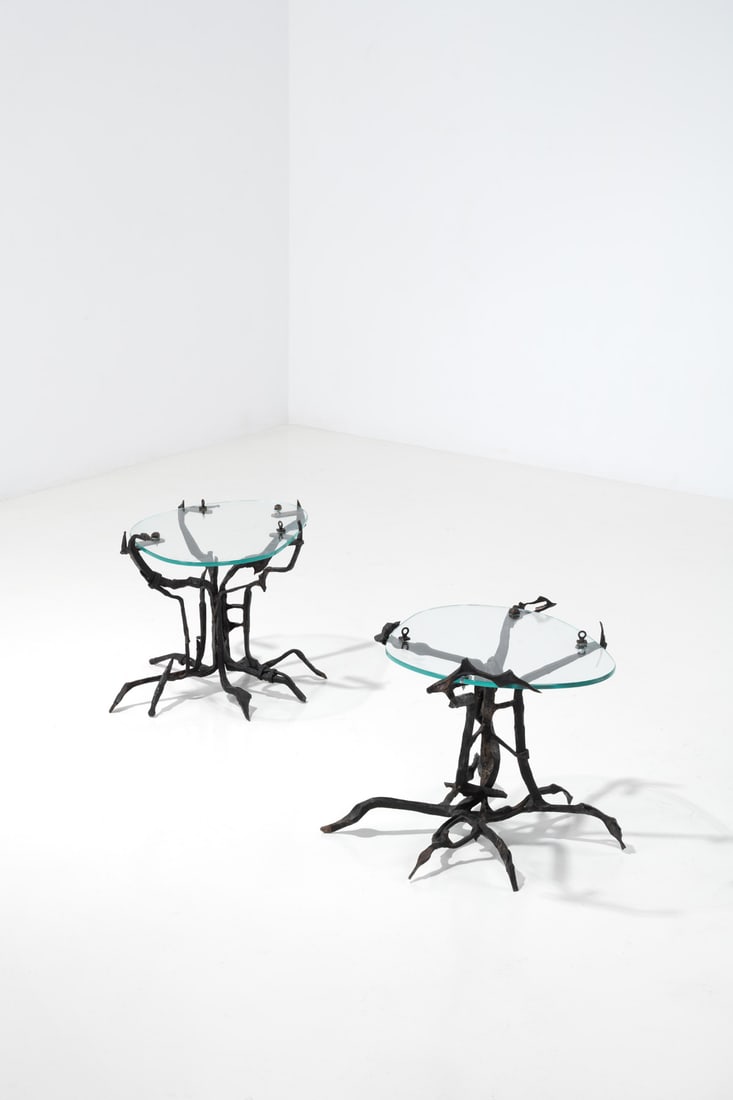 Sido (1934-1986) & François Thévenin (1931- 2016) Pair of side tables - Unique piece: Sido (1934-1986) & François Thévenin (1931- 2016) Pair of side tables - Unique piece Patinated wrought iron and glass Engraved Model created in the 1970s H 48 × L 54 × W 44 cm H