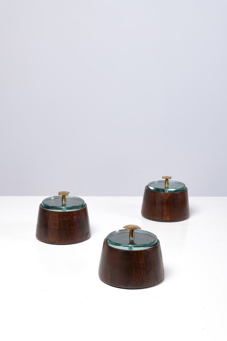 Fontana Arte (edited by, 20th c.) Set of three boxes: Fontana Arte (edited by, 20th c.)Set of three boxesWalnut and glassEdited by Fontana ArteModel created circa 1960H 12 × Ø 14 cm (each)