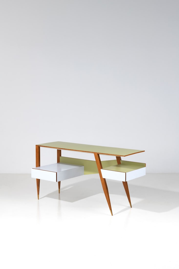 Gio Ponti (1891-1979) Desk: Gio Ponti (1891-1979)DeskAsh wood, brass and melamineEdited by CassinaModel created in 1954H 79 × L 149 × W 64 cmBibliography: G. Bosoni, 'Made in Cassina',Ed. Skira, 2009 similar model p.